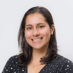Close up of Angelica Larkin smiling at the camera on a plain white background