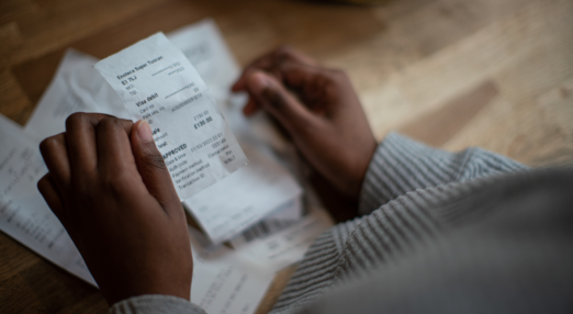 Close up of woman's hands holding a receipt